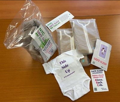 Supplies for infants on a wooden table.