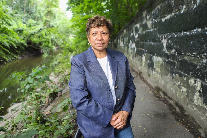 Alexandra Maruri stands along a waterway.