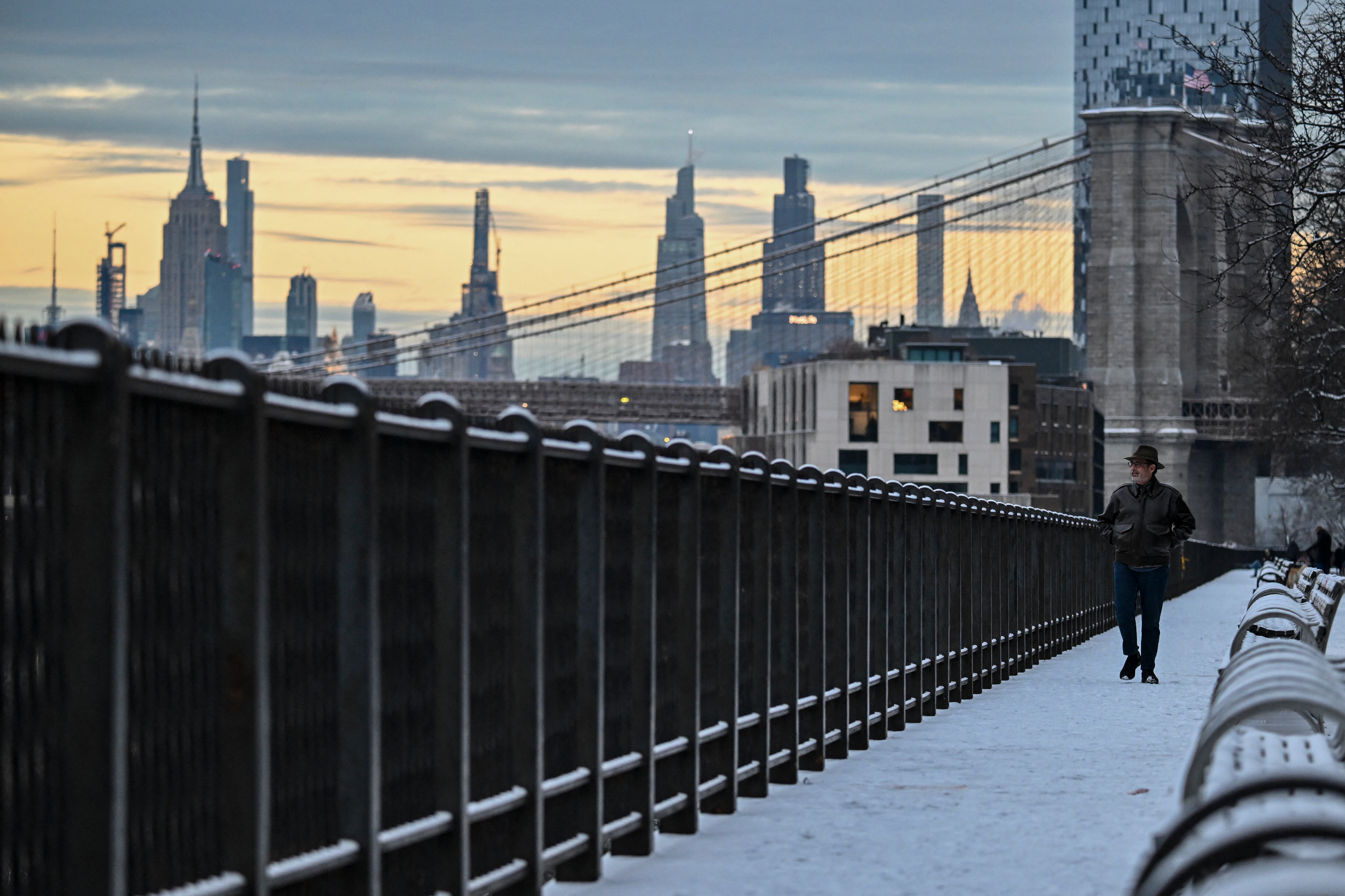 A person walks in the snow in New York City.