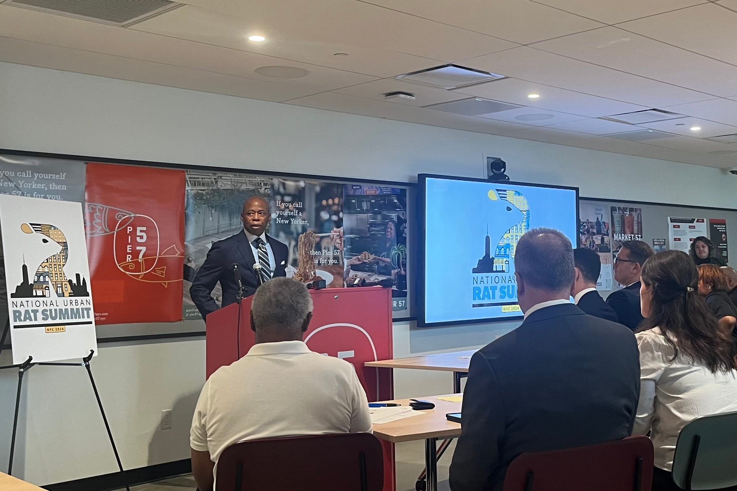 New York City Mayor Eric Adams speaks at a podium.