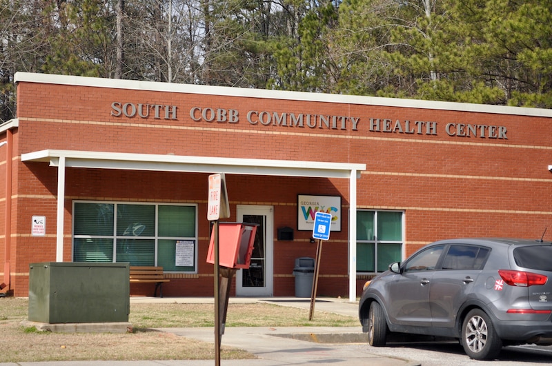 The front entrance of a red brick building.