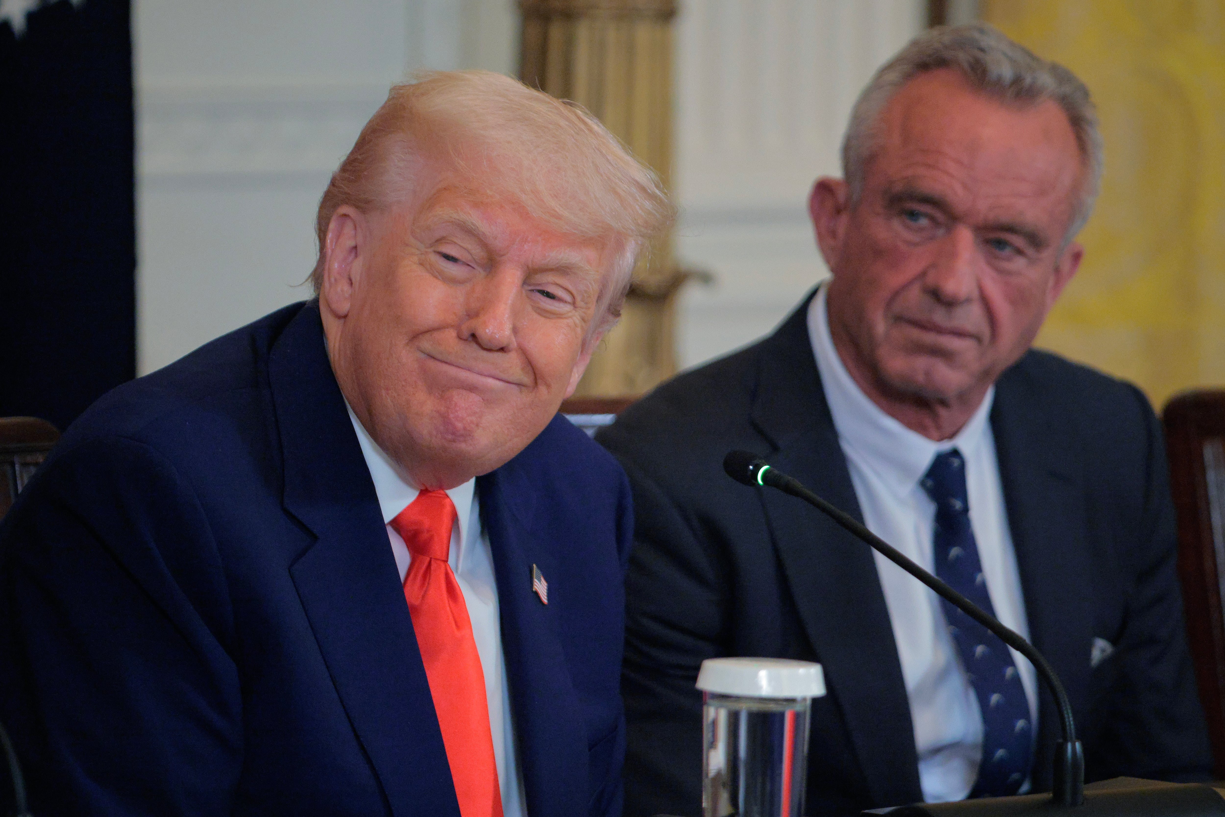 President Donald Trump and Health and Human Services Secretary Robert F. Kennedy Jr. speak at a news conference.