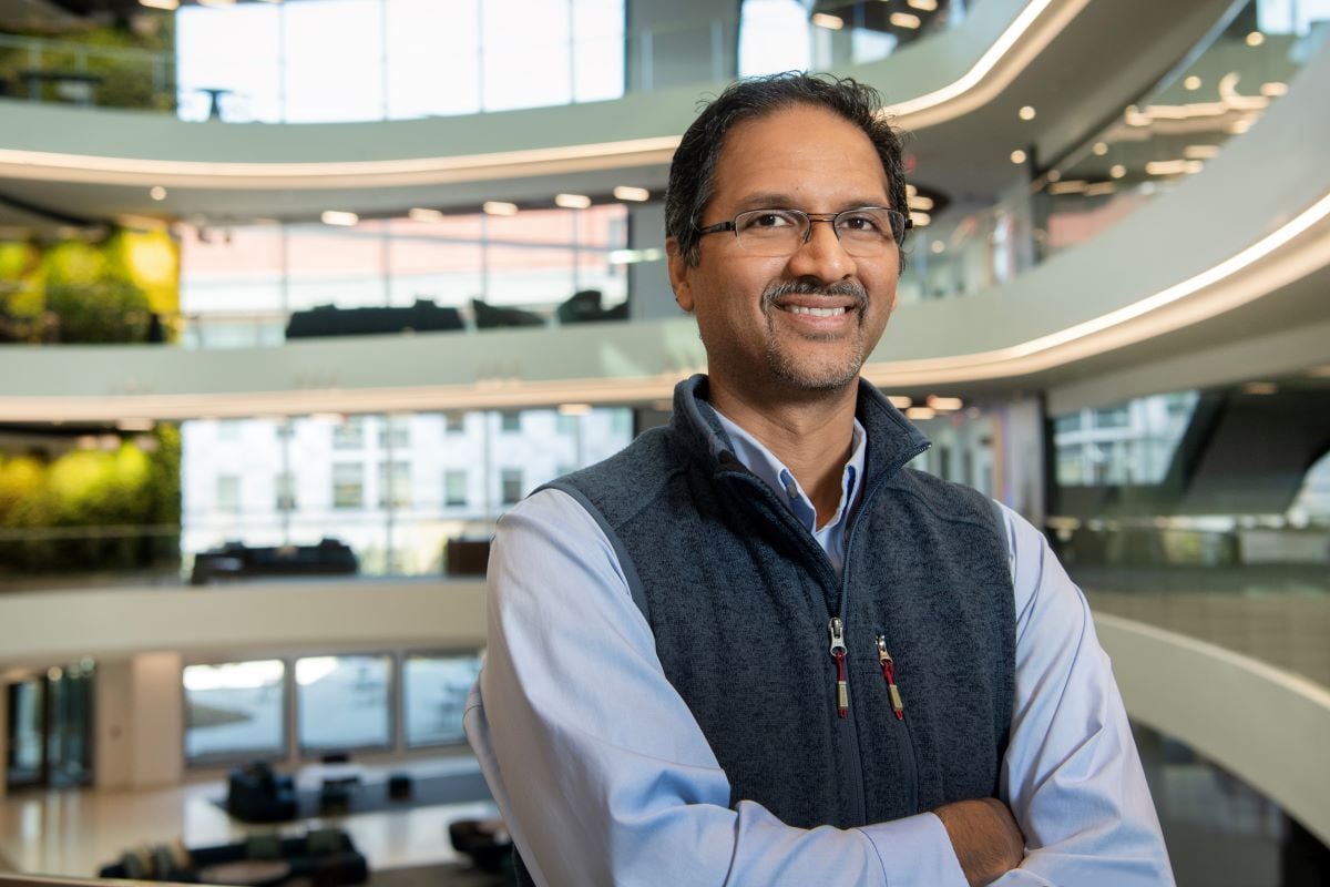 Anant Madabhushi stands in a building atrium.