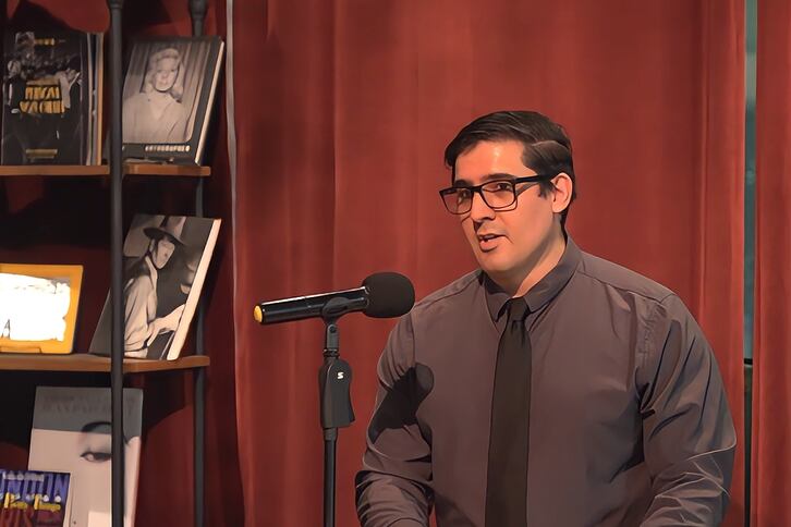 Dr. Jose Martinez-Escudero speaks from a podium.