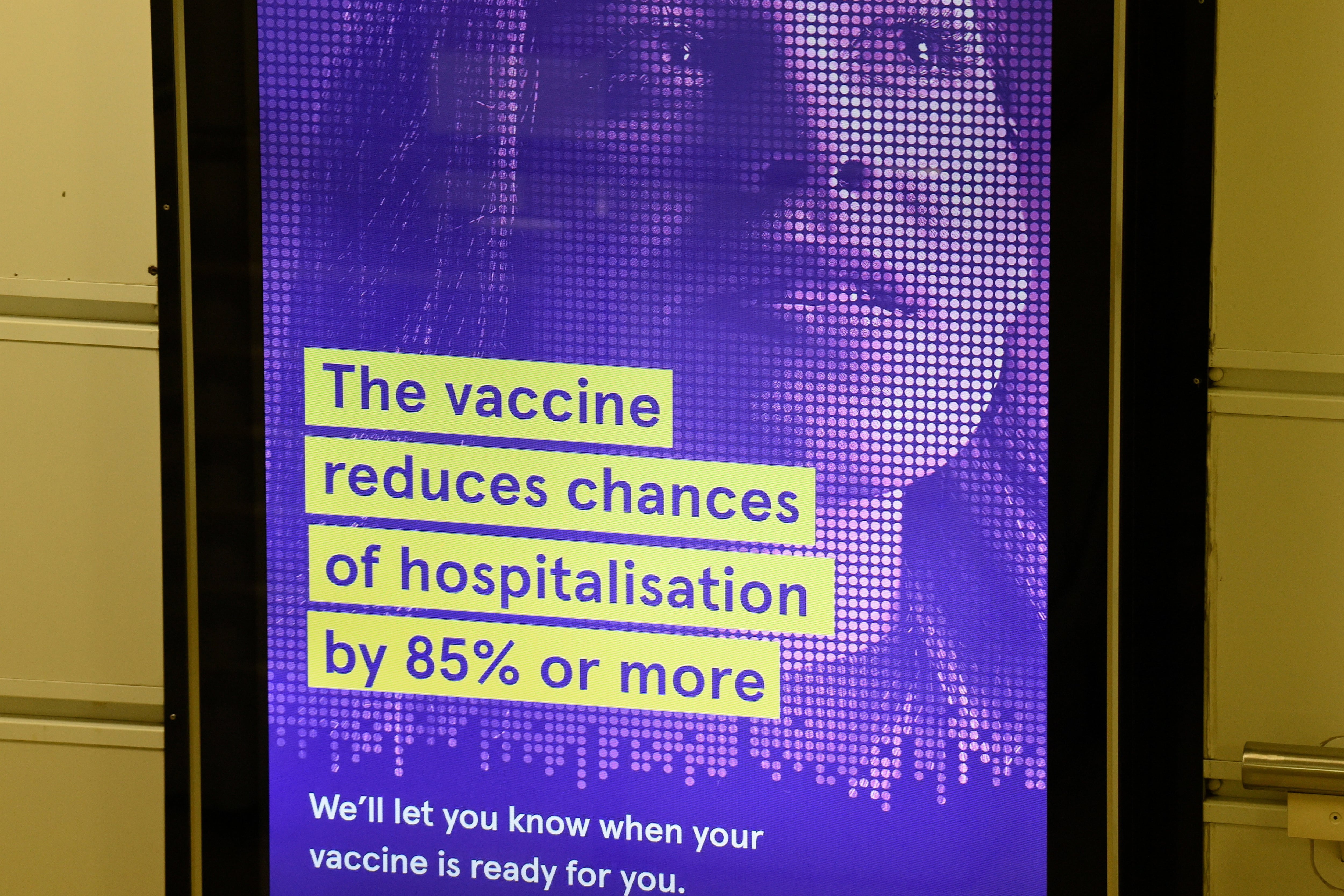 A poster touts benefits of vaccines.