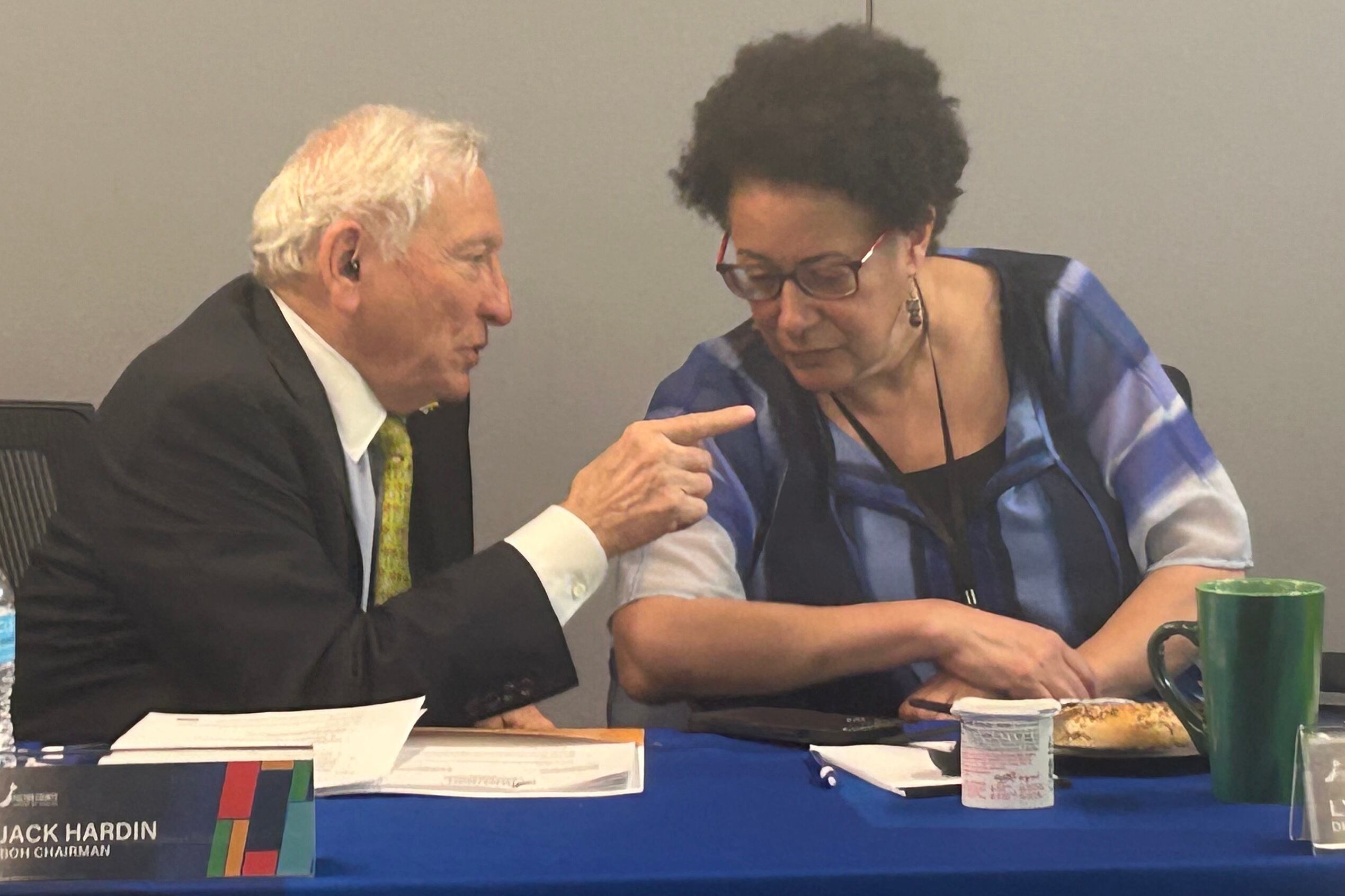Jack Hardin, chairman of the Fulton County Board of Health, speaks with District Health Director Dr. Lynn Paxton at a board meeting.