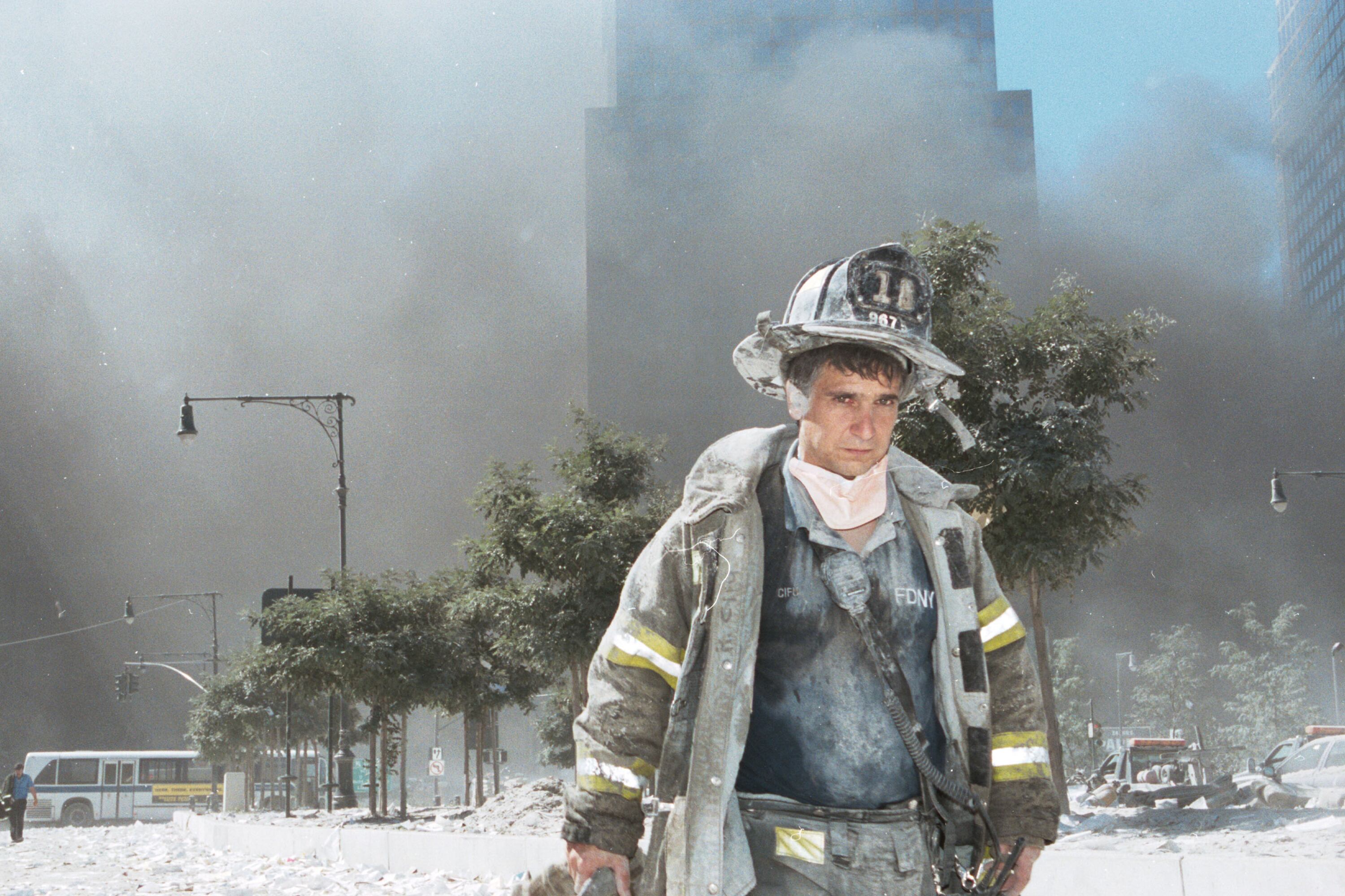 A firefighter is surrounded by smoke at the scene of the 9/11 terrorist attacks on New York on Sept. 11, 2001.