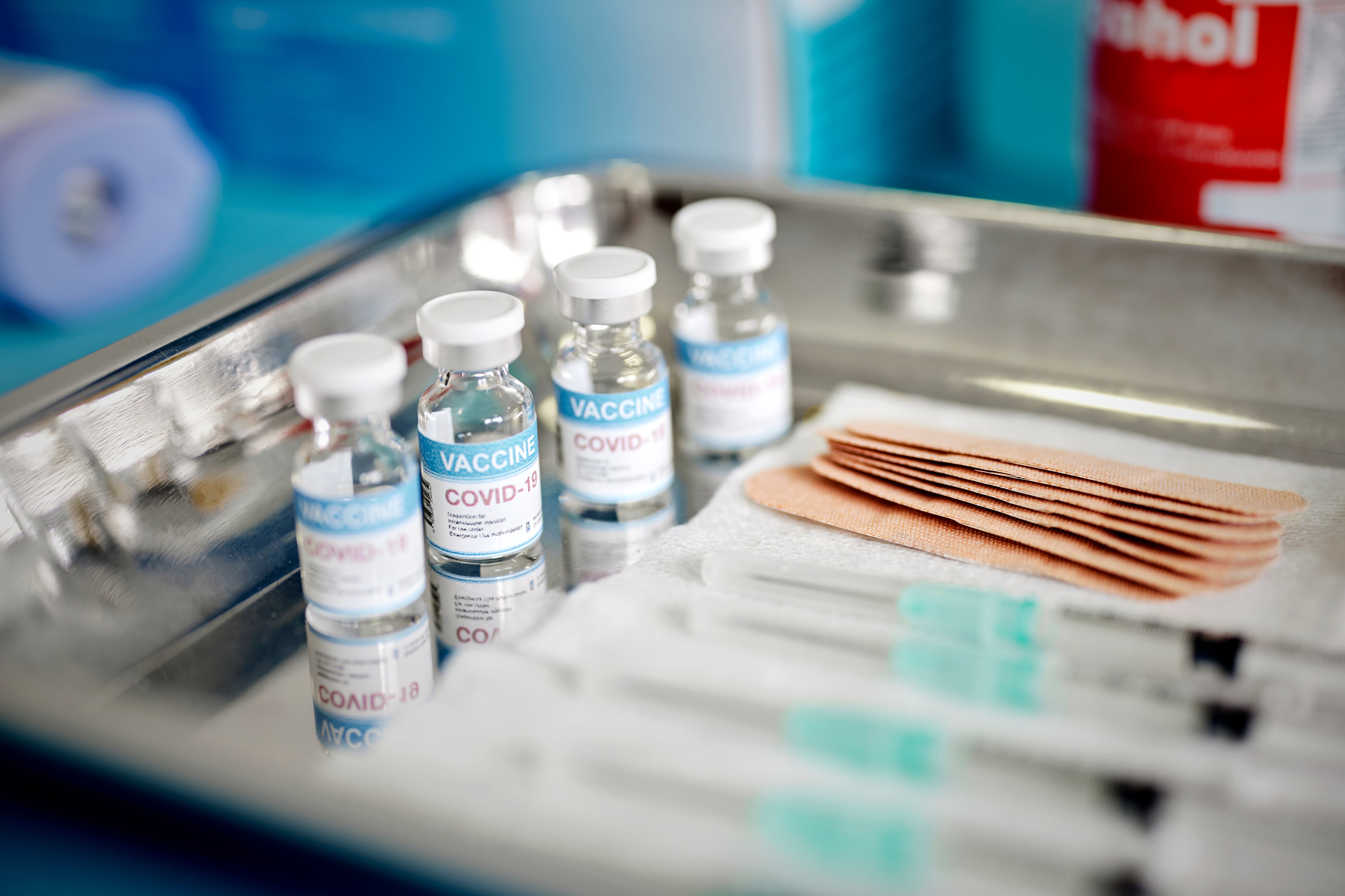 Close up of Vials and Syringes with Covid-19 vaccine are displayed on a tray