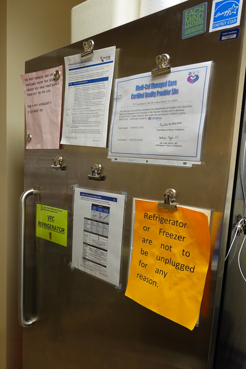 A refrigerator in a doctor's office contains childhood vaccines.