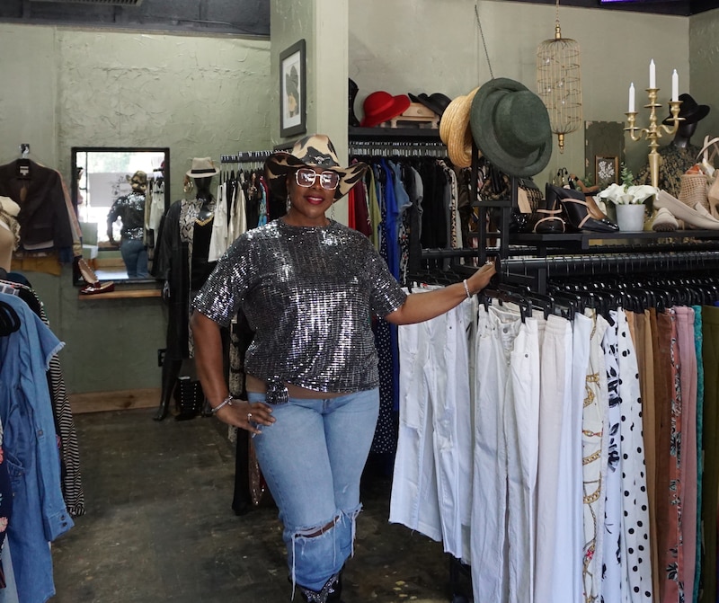 Nikki Hayes stands in her clothing boutique.