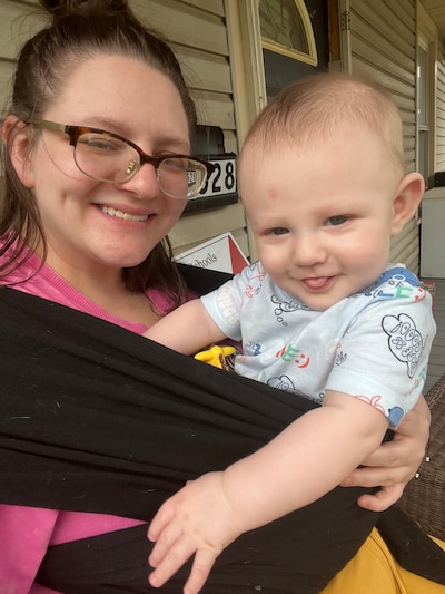 Dezirae Davies holds her infant son.