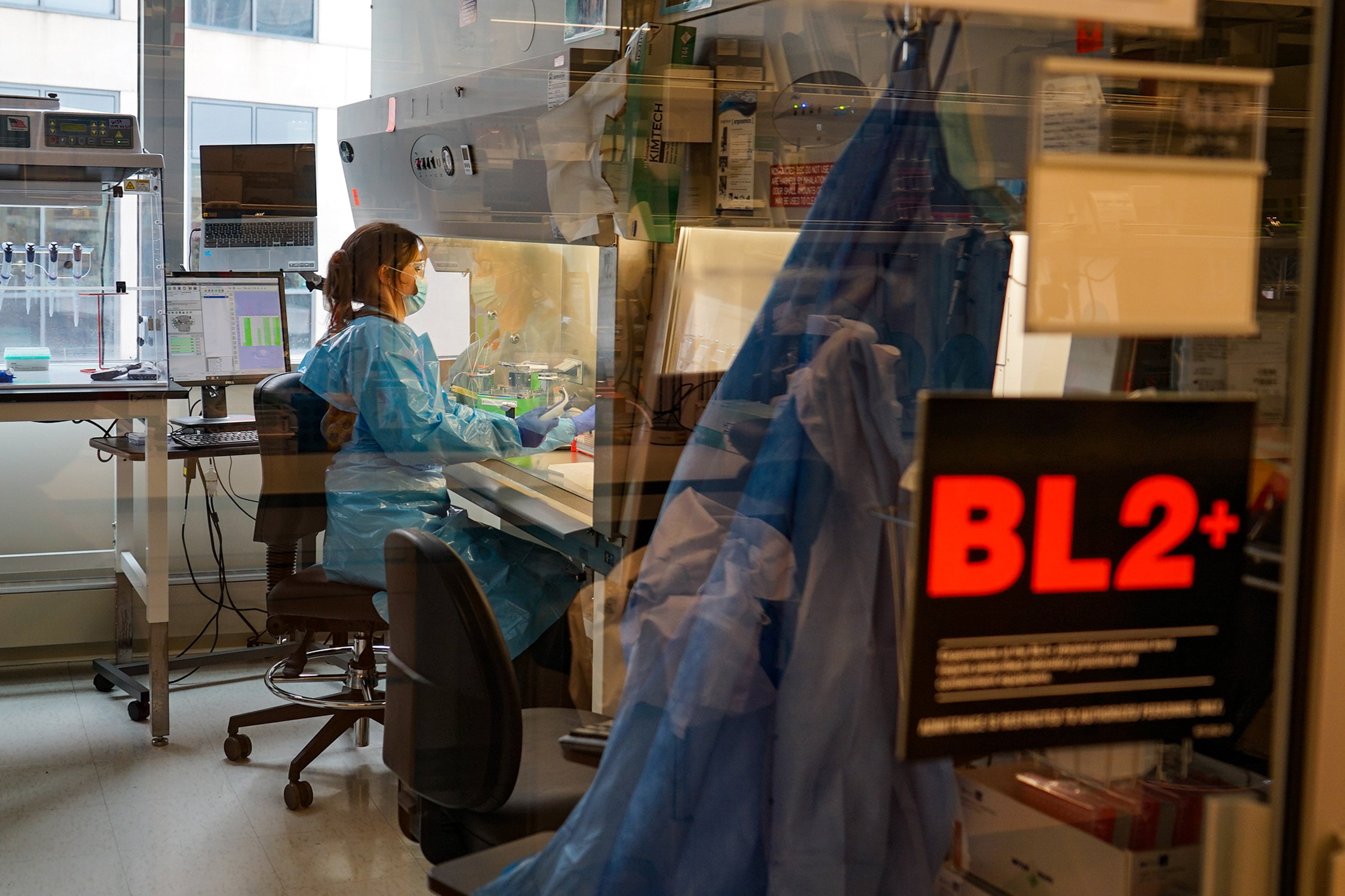 A reasearcher works in a lab.