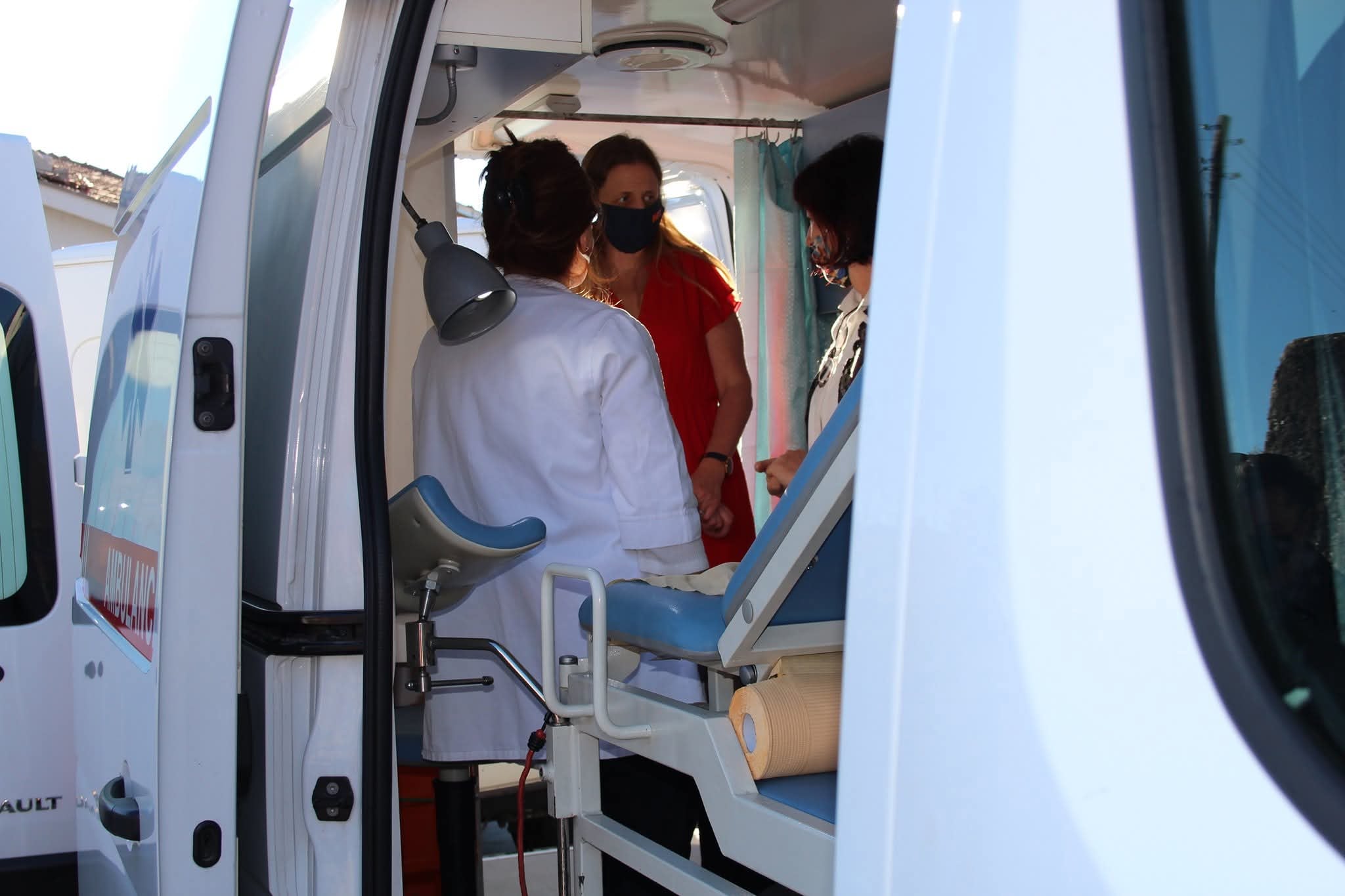 Health workers inside a mobile gynecology unit.