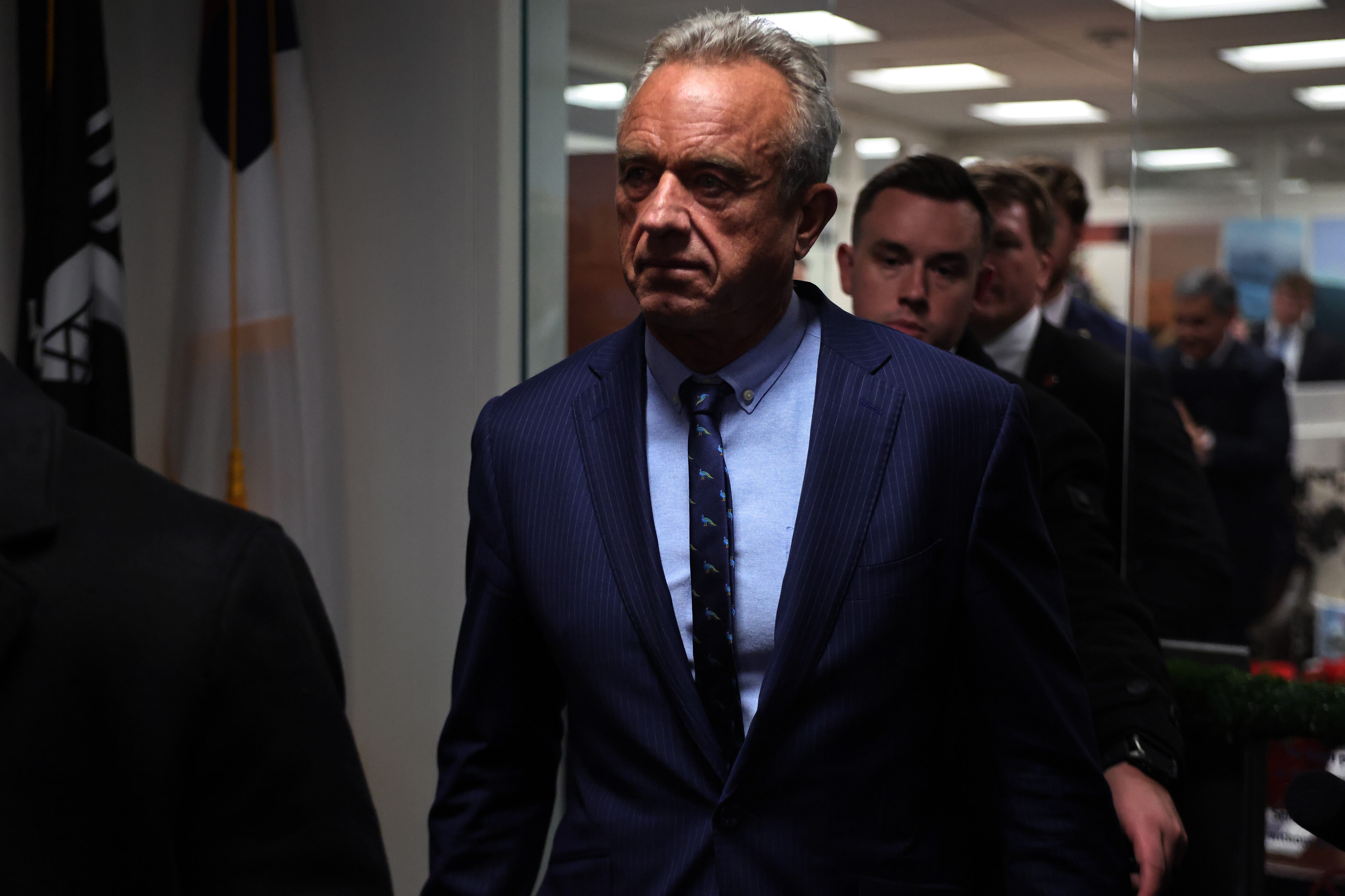 Robert F. Kennedy Jr. walks down a hallway.