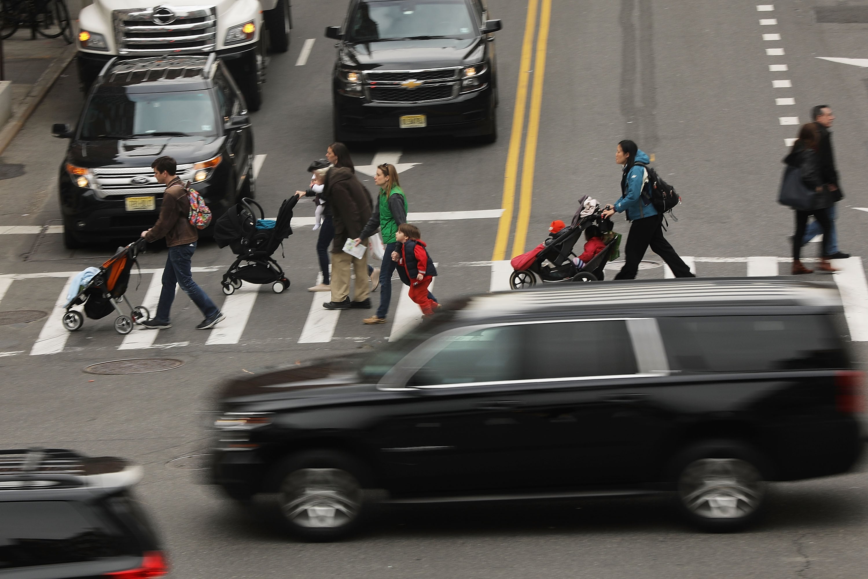 Pedestrians and traffic at a New York City intersection.