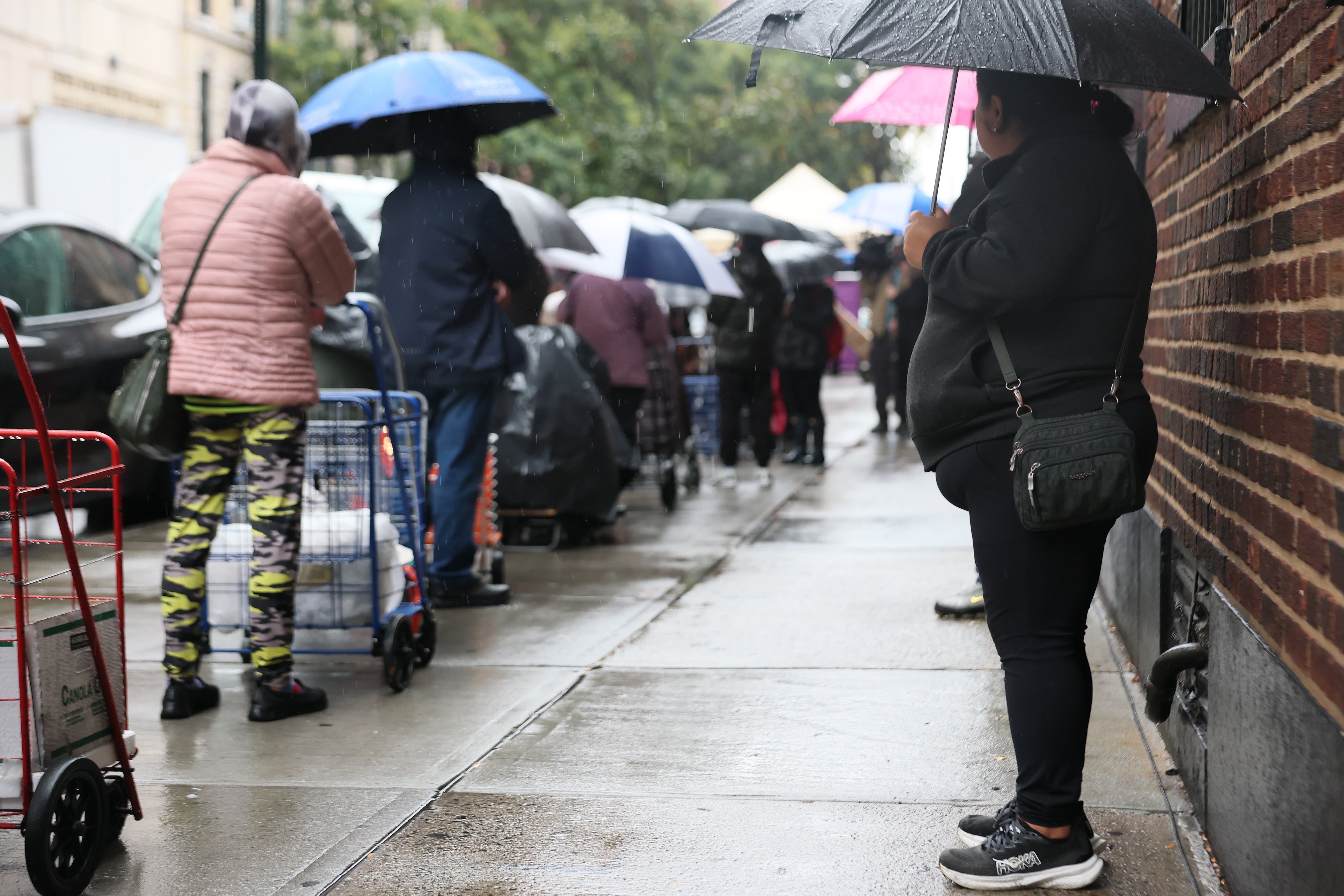 People line up for food distribution in New York City.