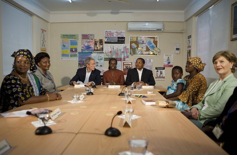George W. Bush meets with people at a hospital in Africa.