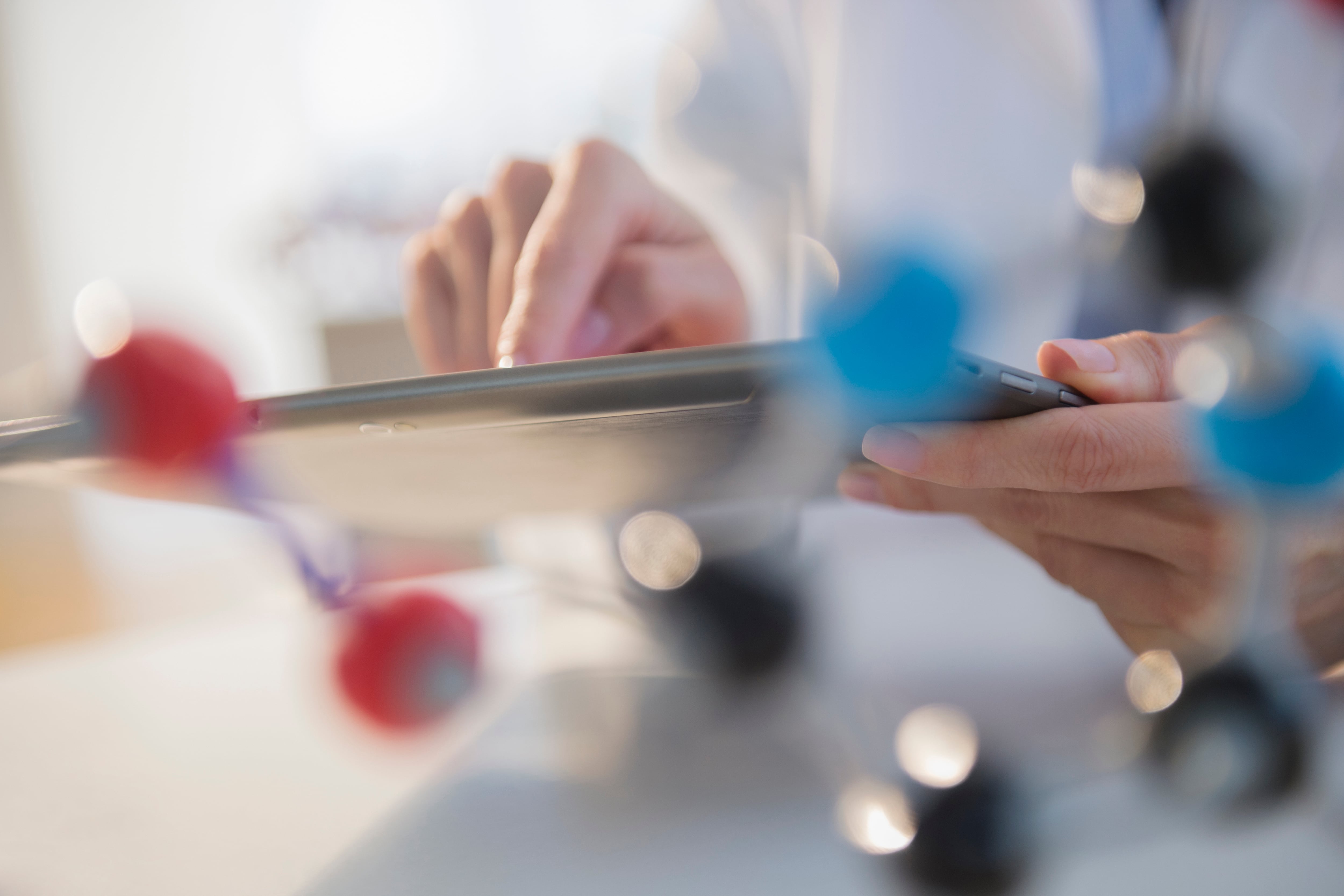 A scientist using digital tablet in laboratory.