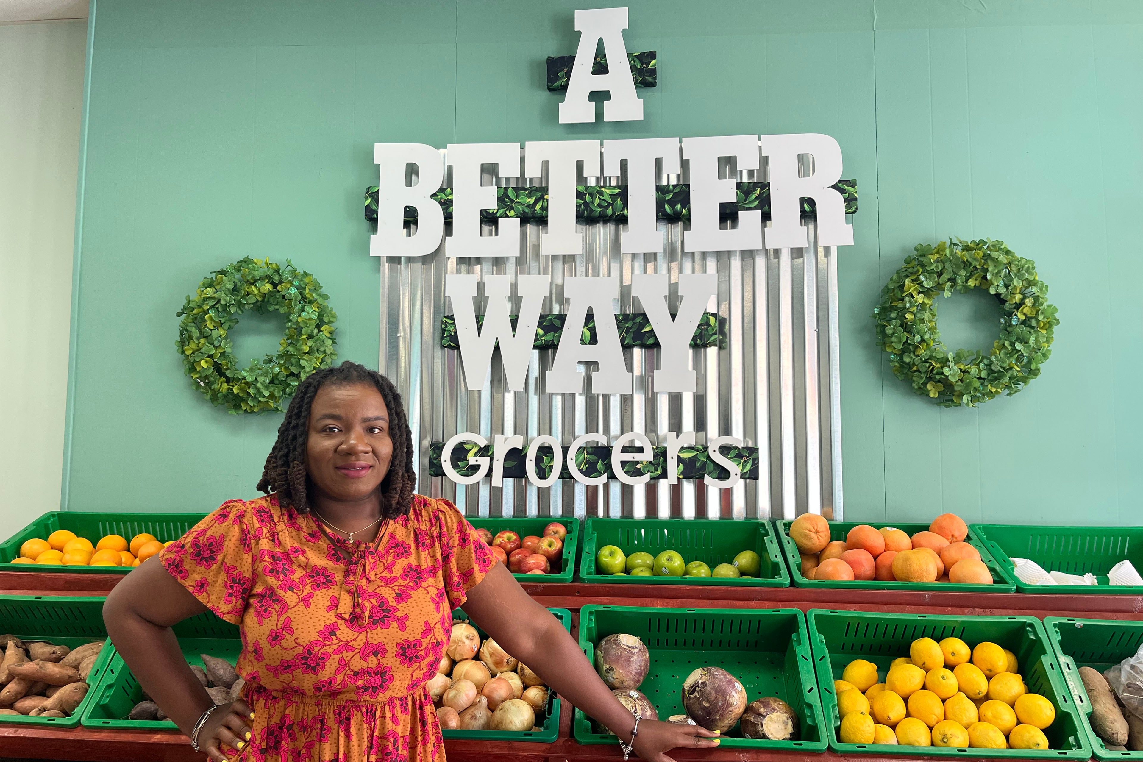 Tiffany Terrell stands in front of a produce display at A Better Way Grocers.