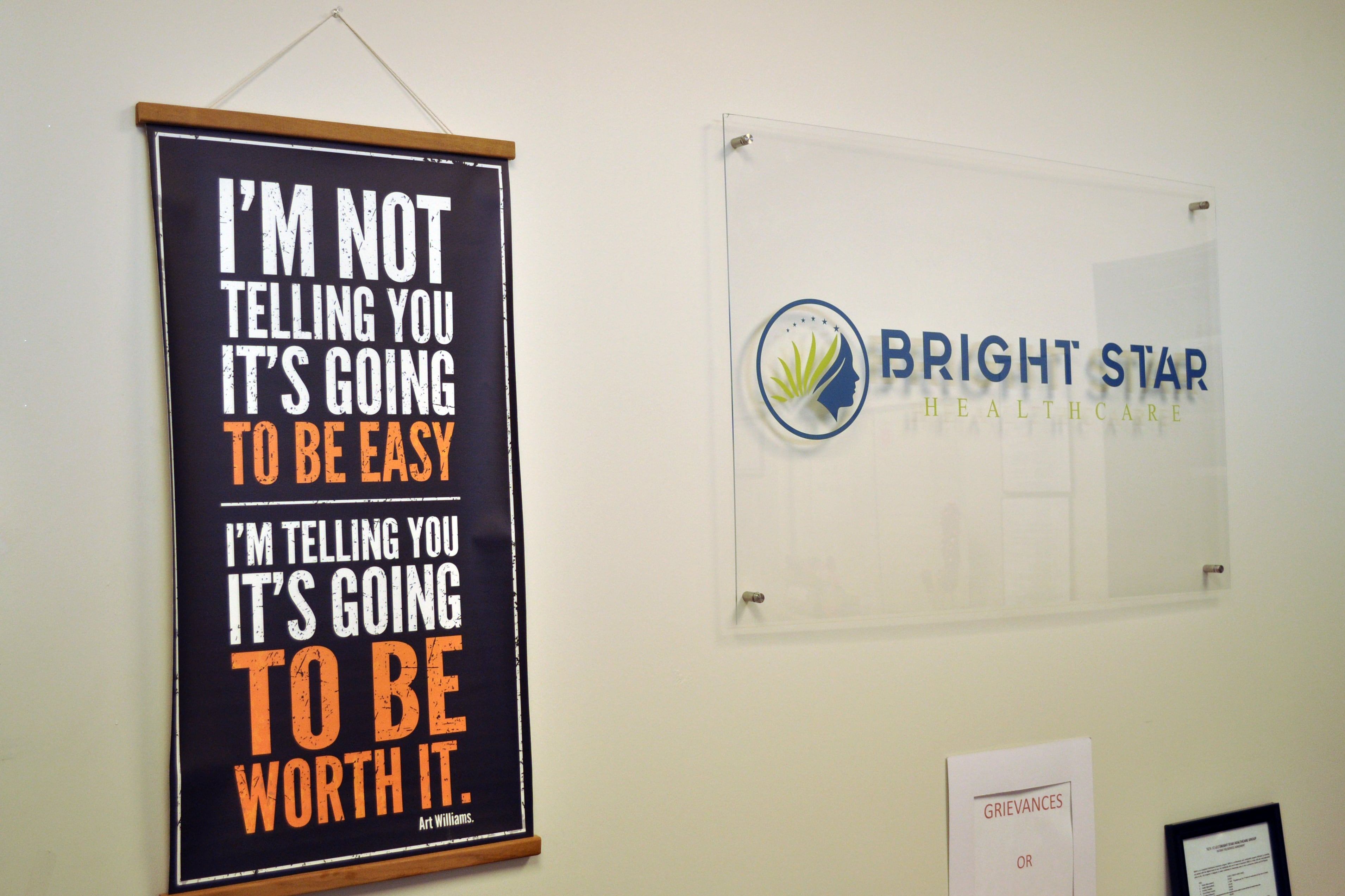 A wall with two signs.