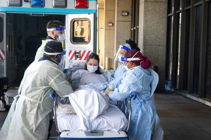 Hospital workers handle a patient during a drill for bird flu in New York.
