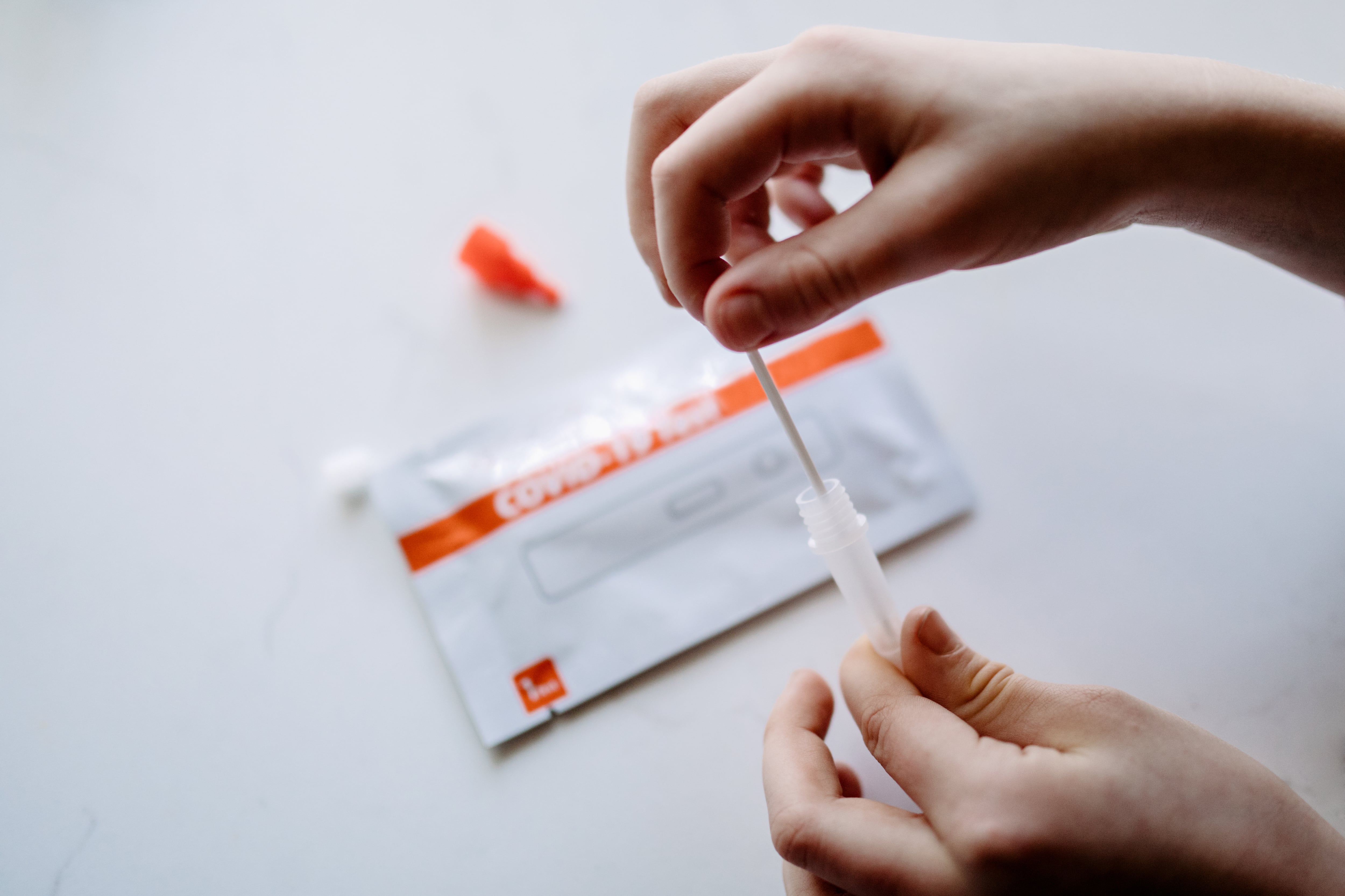 A person holds an at-home Covid test.