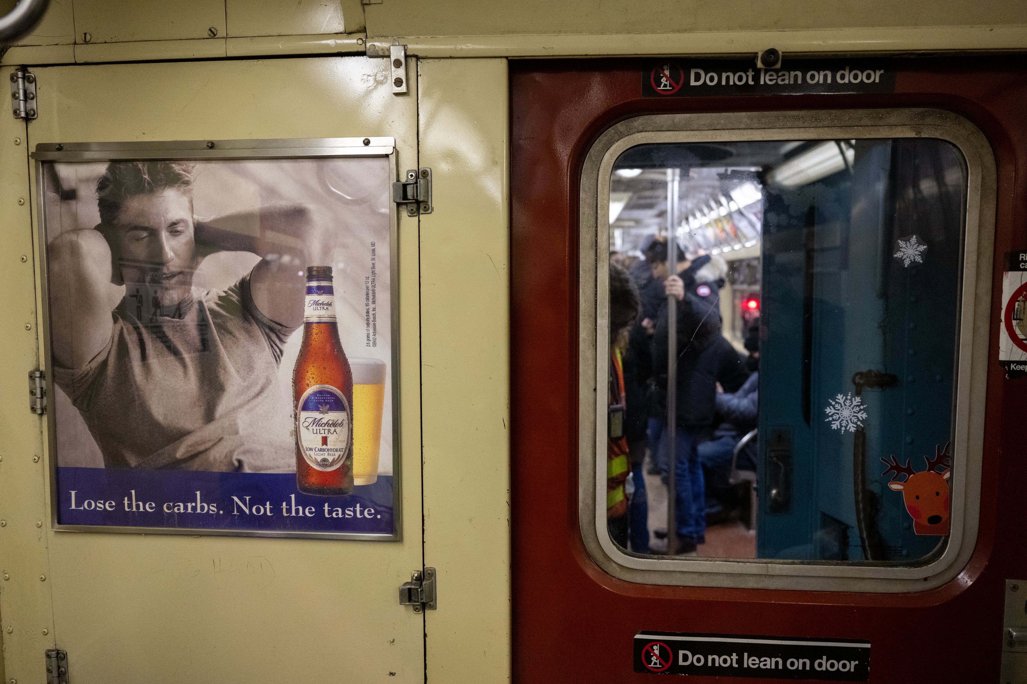 A photograph of the inside of a subway train car.