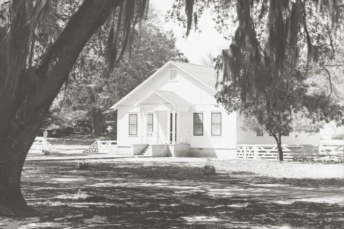This historic image depicts one of the former Malaria Control in War Areas field station buildings